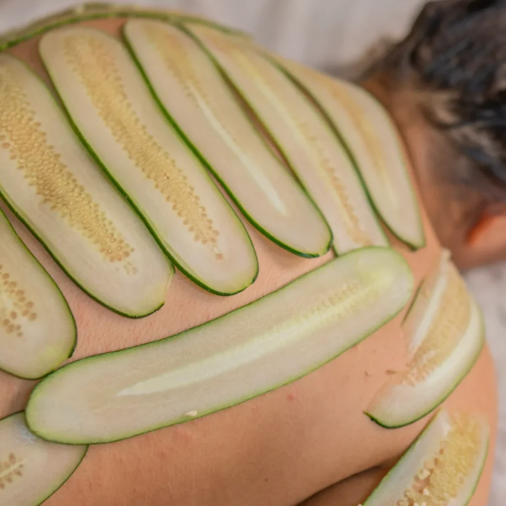 Calm and softly lit room prepared for a cucumber body facial