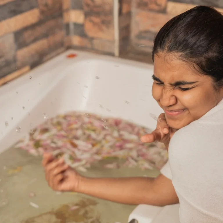 Luxurious spa bath with floating herbs and flowers - Terms